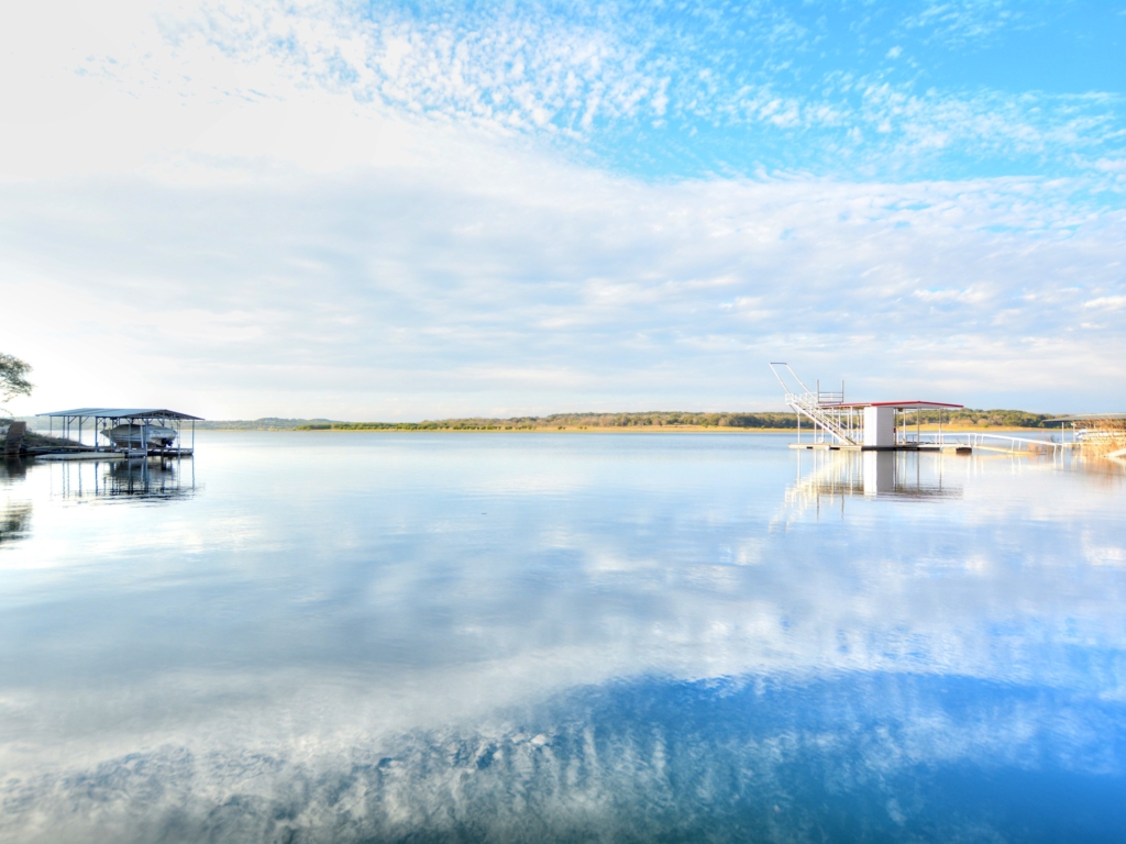 Wake by the lake in this stunning Lake Travis Waterfront Home! Nestled on a quiet cul-de-sac in a sought-after gated neighborhood boasting breathtaking views of the lake and surrounding Hill Country, this home truly shines!